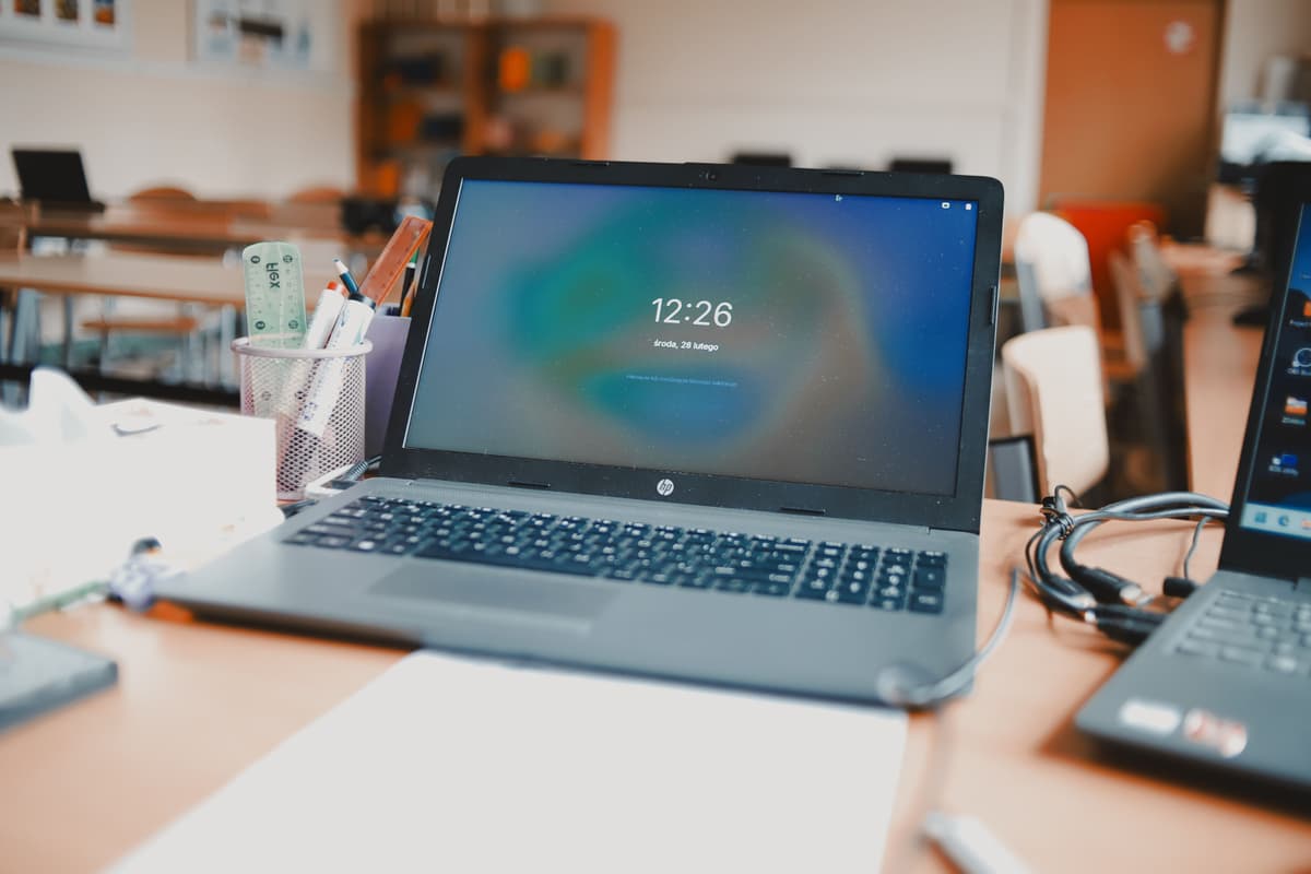 Laptop showing an online traffic theory course interface on a desk